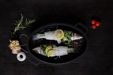 Food photography. Fish. Sea ​​bass with lemon and herbs. Dicentrarchus labrax. Photo for recipe book. Sea food.