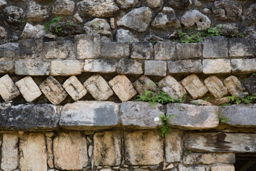 Close-up view of tilted frieze stones at ball court Mayan ruins of Ek Balam, Yucatan, Mexico