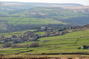 Fototapeta na wymiar a scenic view of the village of old town in calderdale west yorkshire with surrounding pennine farms and hills