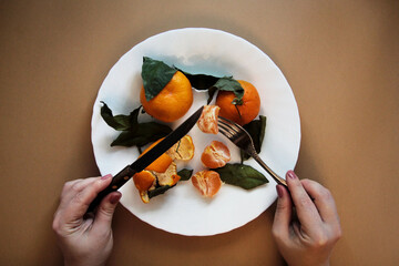 tangerines with peels on a plate