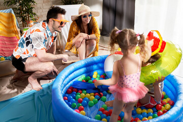 Happy family having fun on the beach at home