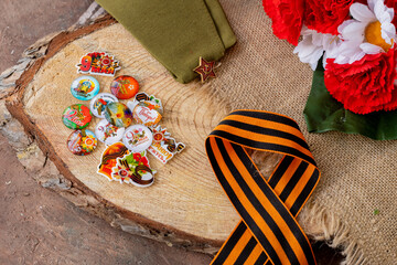Concept background of May 9 russian holiday Victory Day. Red carnations, St. George's ribbon and...