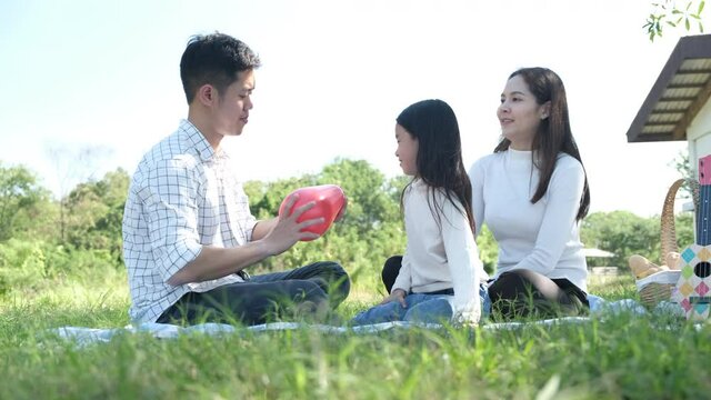 Asian portrait family trip father mother and daughter enjoy relaxation playing balloons with family to lifestyle freedom family vacation caucasian asian.one day trip new normol Coronavirus covid 19