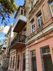 Naklejka premium House with an old architecture with beautiful antique balcony
