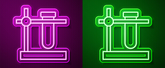 Glowing neon line Glass test tube flask on stand icon isolated on purple and green background. Laboratory equipment. Vector