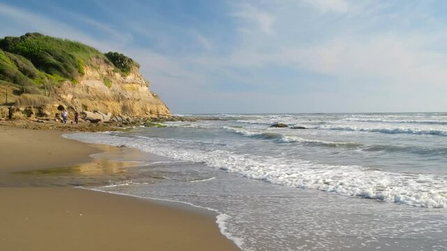 Lavinio sand beach with the cliff of Tor Caldara natural reserve in Tyrrhenian sea, Anzio, Rome, Italy