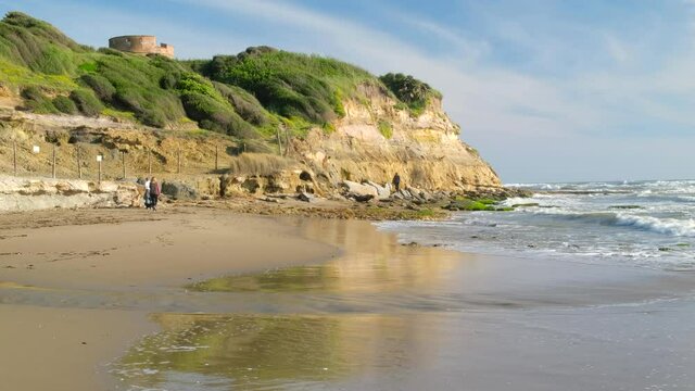 Lavinio sand beach with the cliff of Tor Caldara natural reserve in Tyrrhenian sea, Anzio, Rome, Italy