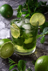 Cool summer drink with lime. Drink on the rocks. A cold drink with ice and lime.