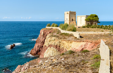 Fototapeta na wymiar The Tower Alba or Tower of Cala Rossa, is a defense tower on the coast of the Mediterranean sea in Terrasini, province of Palermo, Sicily, Italy