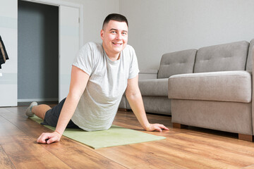 Fototapeta premium Man doing exercises at home