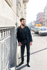 young man bearded posing outdoor serious