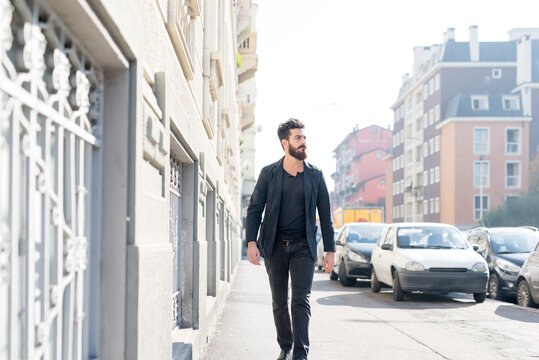 young man bearded outdoor walking