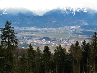 View of the town of Radovljica in Gorenjska, Slovenia surrounded by fields and forest covered mountains behind