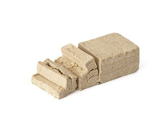 Sliced halva isolated on a white background. Traditional oriental dessert.