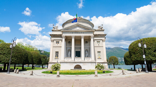 The famous "Tempio Voltiano" (translation: Alessandro Volta's Temple). Alessandro Volta was an italian scientist. Blue sky and white clouds on the background.