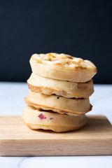 Fototapeta na wymiar Round raisin waffles on white background