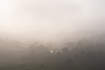 Sun rays and misty at the valley on Bao Loc town. The far side is Tan Hoa Church in Lam Dong province, Vietnam.