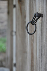 Close-up of rustic handle on old wooden doors. Cracked wood material structure. Selective focus. Byeongsan Seowon, Andong, South Korea.
