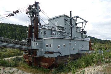 Fototapeta premium Old historic rusty abandoned Gold Dredge n.4, Klondike Gold Rush, Bonanza Creek, Dawson City, Yukon, Canada