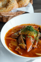 Azerbaijani soup with paprika and buns. Eastern cuisine.