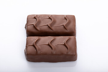 Milk chocolate bar on a white background