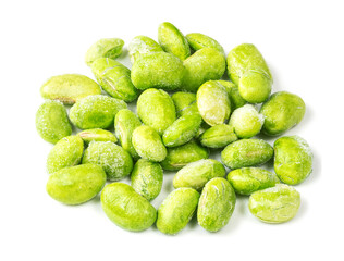 handful of frozen Edamame closeup on white
