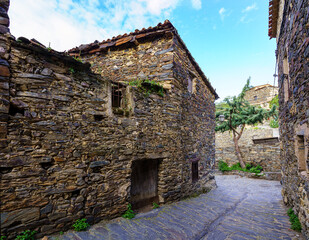 Narrow alley with old stone houses and an atmosphere from another time. Patones de Arriba Madrid.