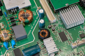 green electronic board with radio parts close up