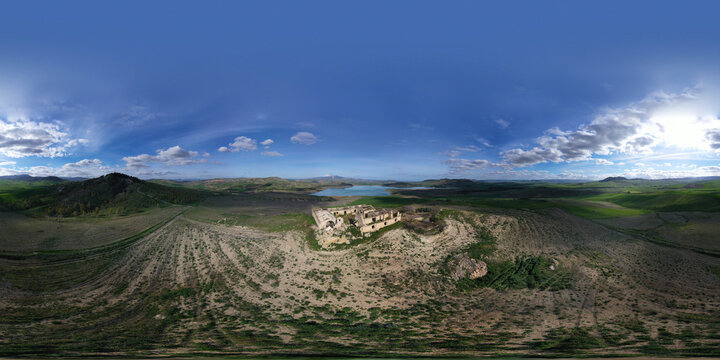 360 degree aerial photo of Ogliastro lake in the heart of Sicily with Etna view. Place of great naturalistic value surrounded by hills planted with cereals. A destination for migratory bird species.