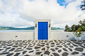 Iconic blue door in the bank of Tondano Lake, a beautiful tourist destination in Minahasa, North Sulawesi, Indonesia.