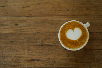 cup of coffee on wooden table