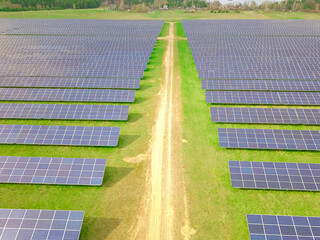 Drone view of a solar power plant on a sunny day. Solar farm system with a drone. A source of ecological renewable energy