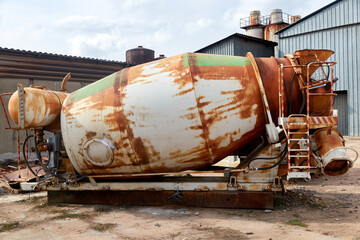 old rusty concrete mixer removed from the truck