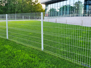 grating wire industrial fence panels, pvc metal fence panel and neatly trimmed lawn.