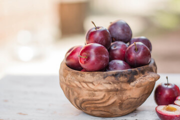ripe plums on the table