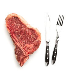 Raw beef steak on the bone with a fork and knife on a white background. Top view with copy space