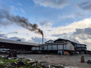 Fototapeta na wymiar Steam discharge hose In the industrial factory area, the electrical. Emissions of smoke and waste from industrial plants, pollution from inside the factory. Air pollution and environment