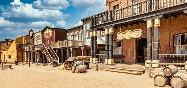 Vintage Far West town with saloon. Old wooden architecture in Wild West.