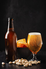 alcoholic drinks, beer with foam isolated on black background..