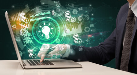 Business hand typing on a modern laptop