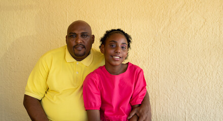 Portrait of Father and Daughters at Home on the Patio