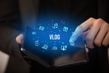 Businessman holding a foldable smartphone, social media concept