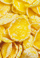 Yellow Cornflakes close up photo, Food texture background, top view. Macro shot. Perfect breakfast.