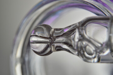 a cosmetic pipette filled with a bubbling liquid and a bottle. close-up.