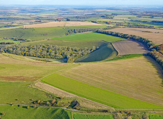 Fototapeta na wymiar Paragliding above the fields at Monks Down in Wiltshire