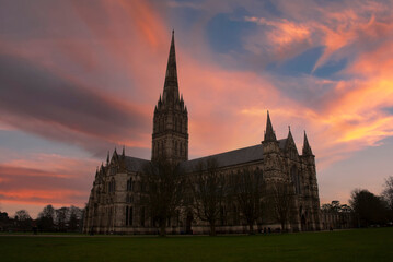 Fototapeta na wymiar The silhouette of Salisbury Cathedral at sunset in Wiltshire, UK