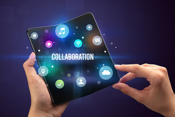 Businessman holding a foldable smartphone