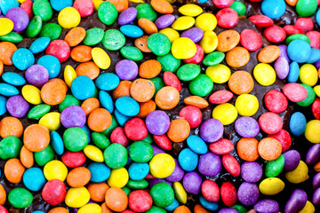 Fototapeta na wymiar Pile of colorful sweet candy chocolates.