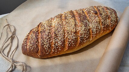 Homemade bread with seeds on a craft paper