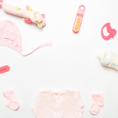 Composition with baby accessories on white background. Frame baby background. Child clothes and accessories for kids. Copy space.